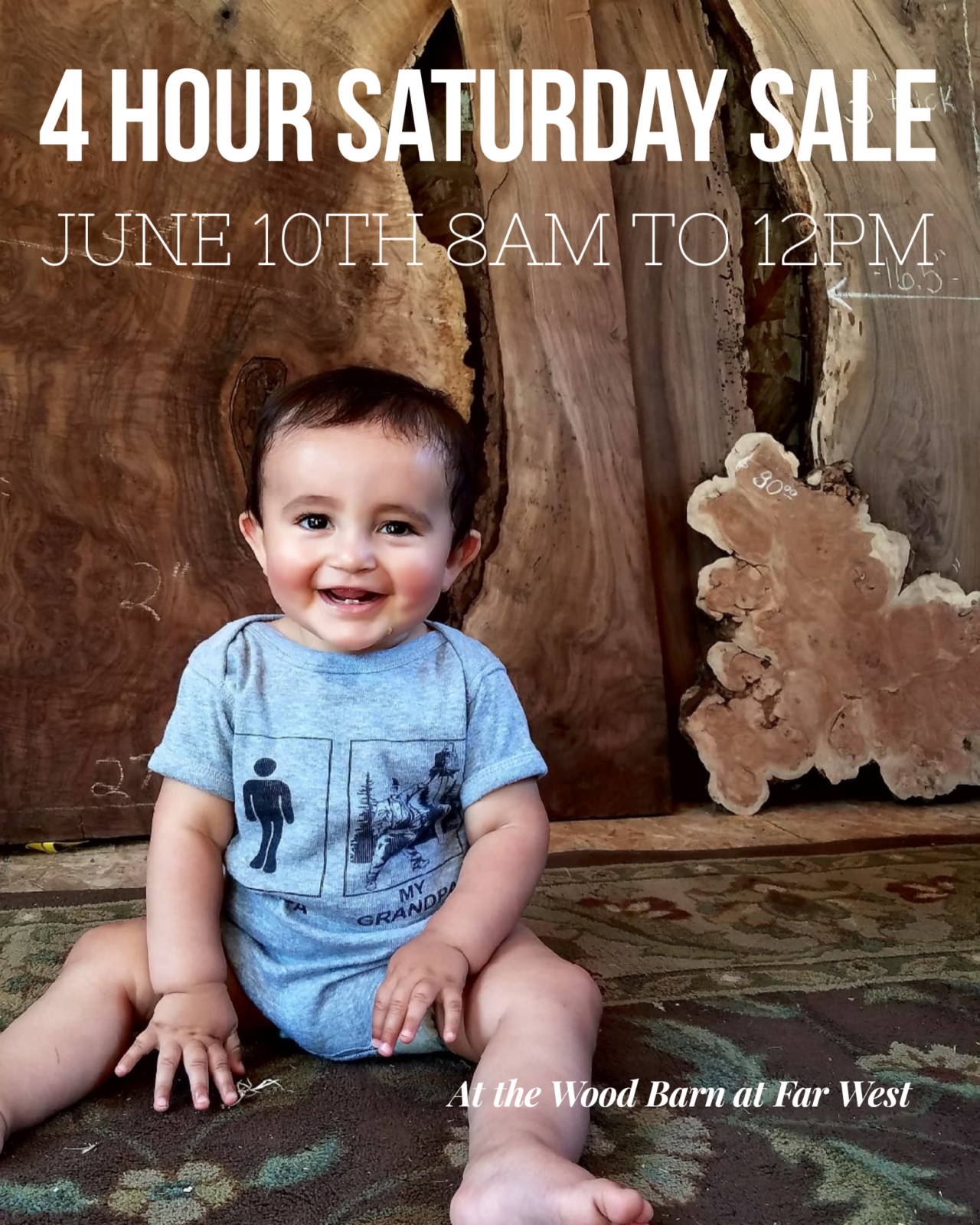 Cute baby in front of walnut lumber for Saturday 4 hour lumber sale June 10th from 8am to 12noon