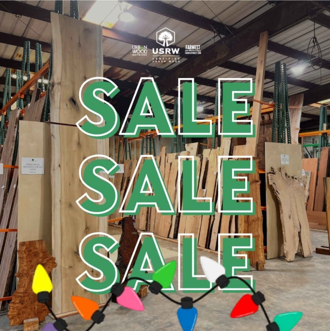 image of wood slabs in sales racks, with text in front showing SALE and Christmas lights for decoration