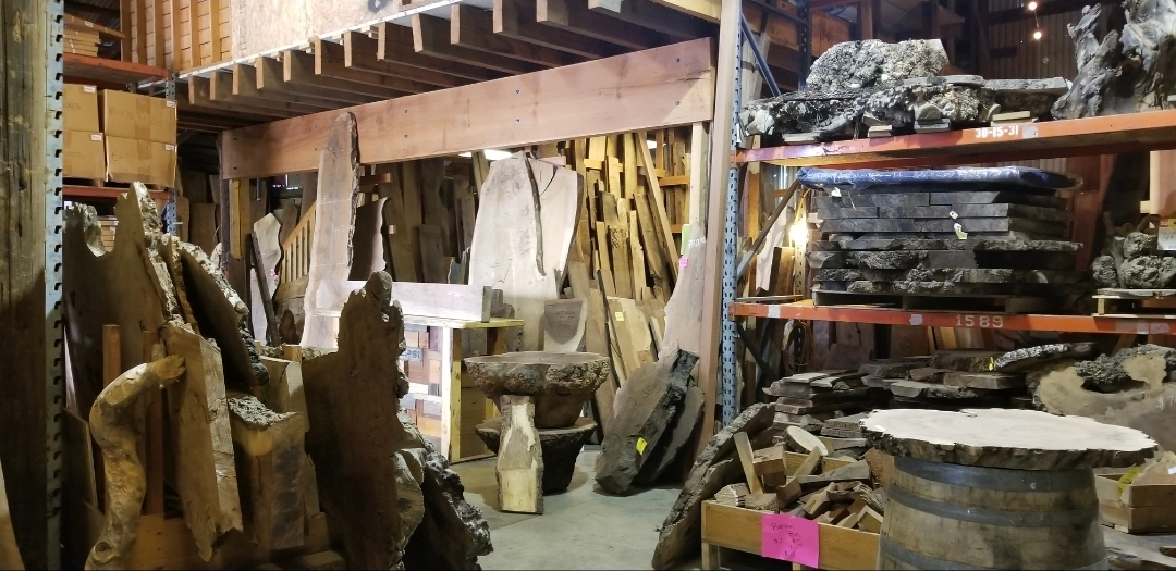 Multiple slabs of lumber leaned onto the wall.